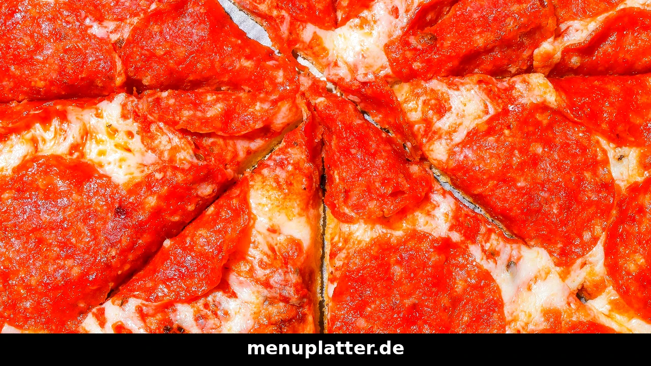 Domino's Germany menu prices with a close-up of pepperoni pizza covered in melted cheese and salami slices