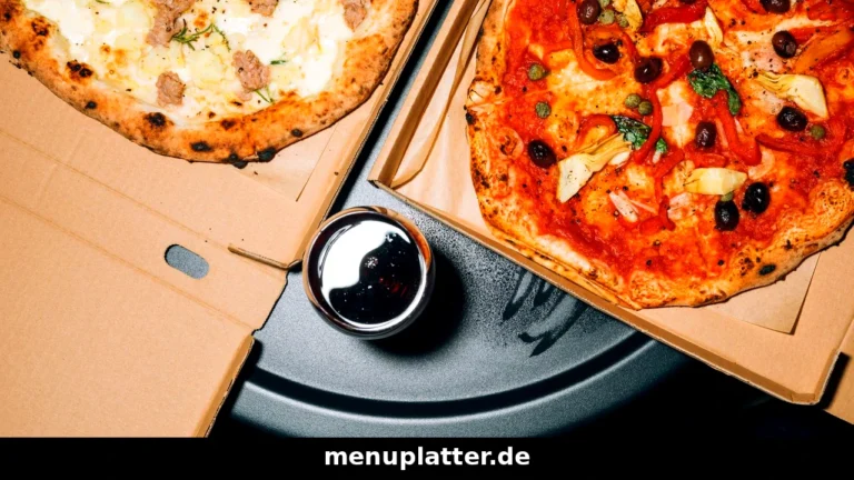 Domino's Preise München mit Pizza, Pasta und Chicken Wings auf einem Tisch