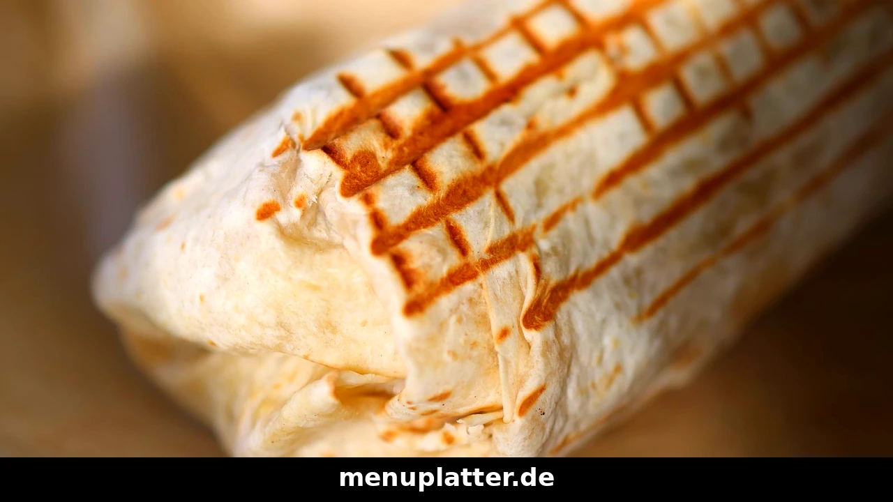 döner kebab prices Germany with a freshly grilled dürüm wrap, toasted flatbread and juicy kebab filling on baking paper
