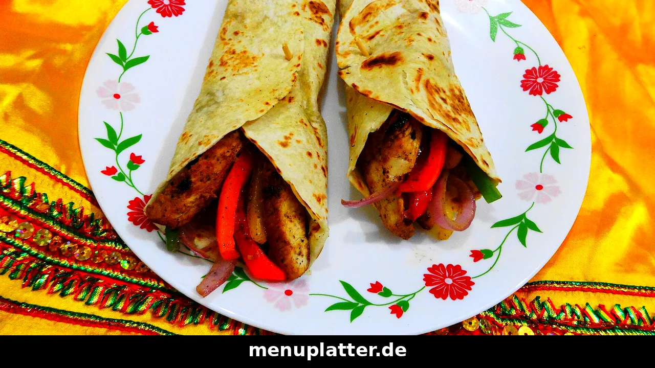 KFC Preise Stuttgart mit zwei Chicken Wraps, Paprika und Zwiebeln auf einem Teller