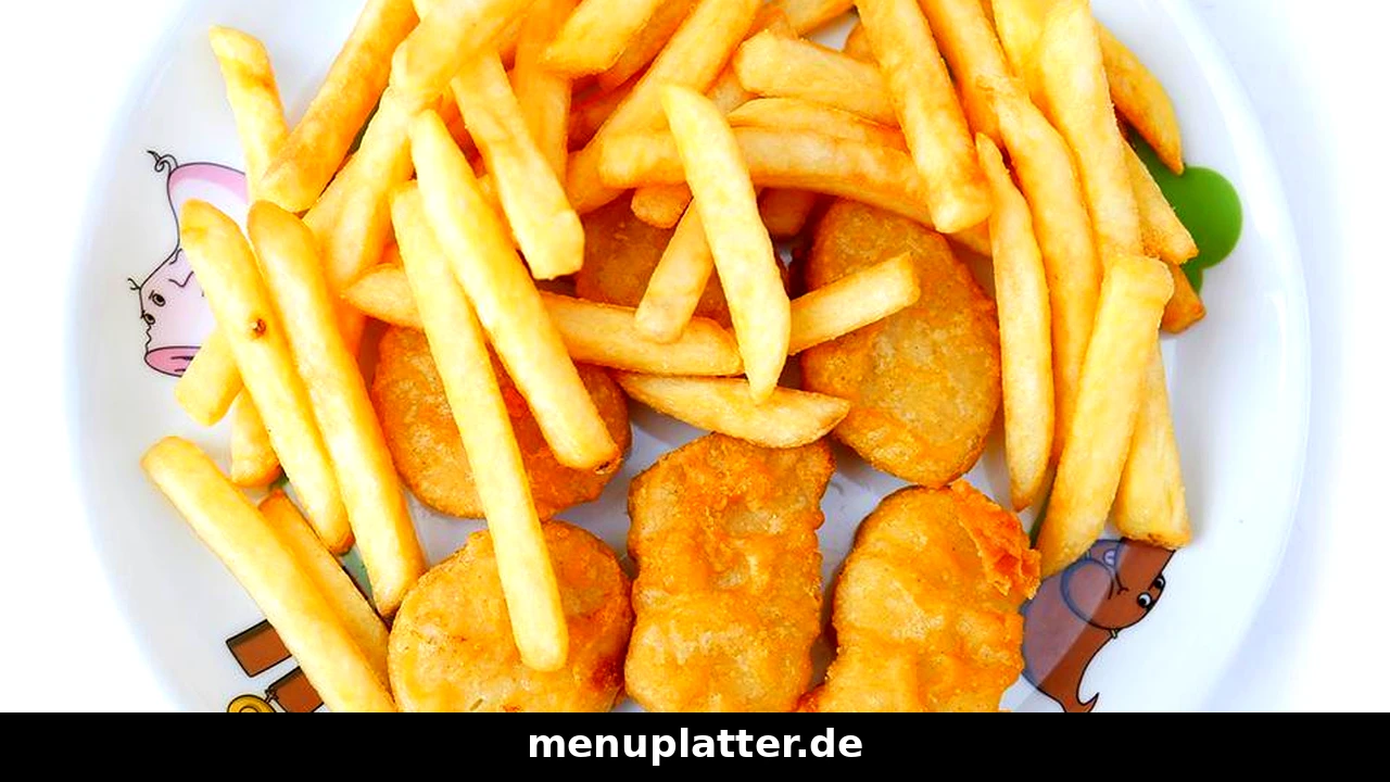 Kids menu prices Germany with chicken nuggets and fries on a colourful kids plate with cartoon animals