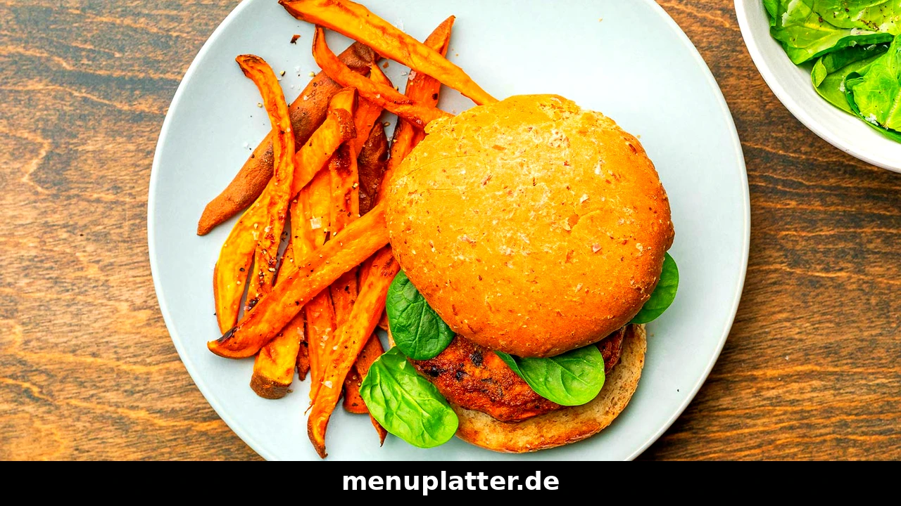 Peter Pane Preise Lübeck mit Süßkartoffel-Pommes mit einem Burger auf einem Teller