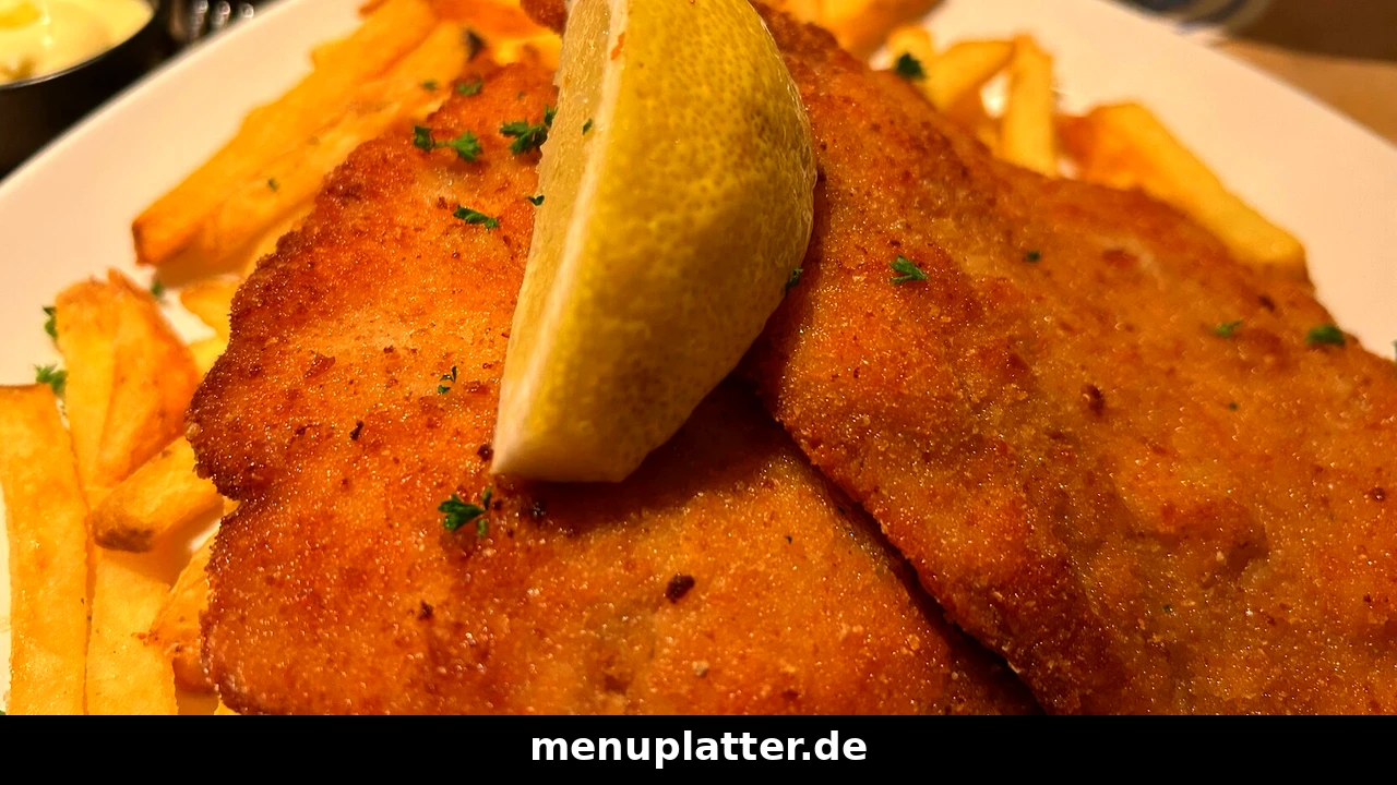 Schnitzel Preise Hannover mit einem knusprigen Schnitzel mit Pommes frites und Zitrone